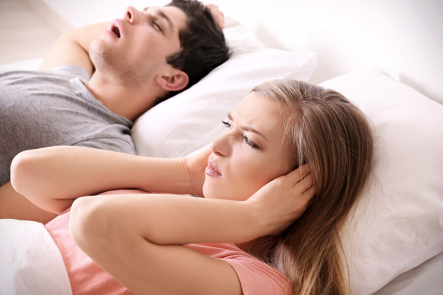 couple laying down in bed