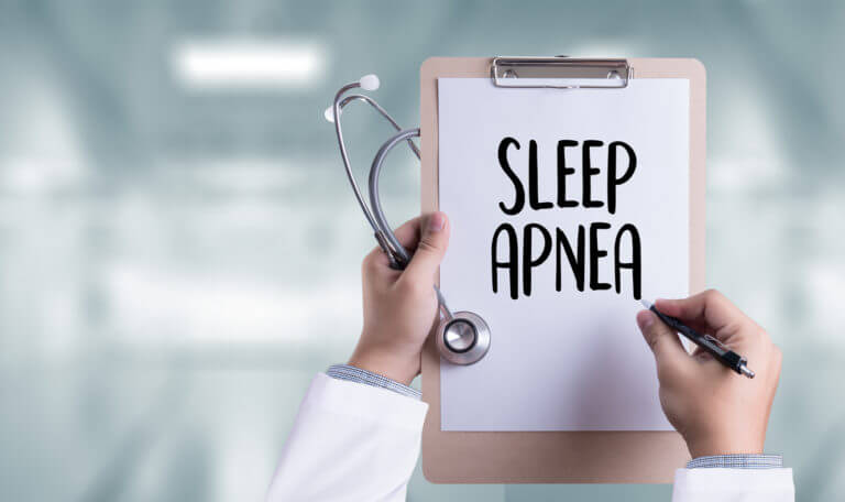 clipboard with sleep apnea words on paper