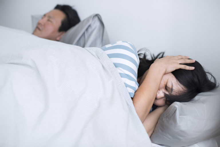 husband snoring with wife awake