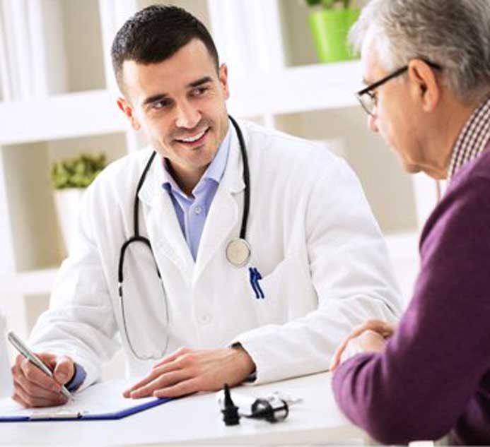 stock image shows doctor talking to patient image