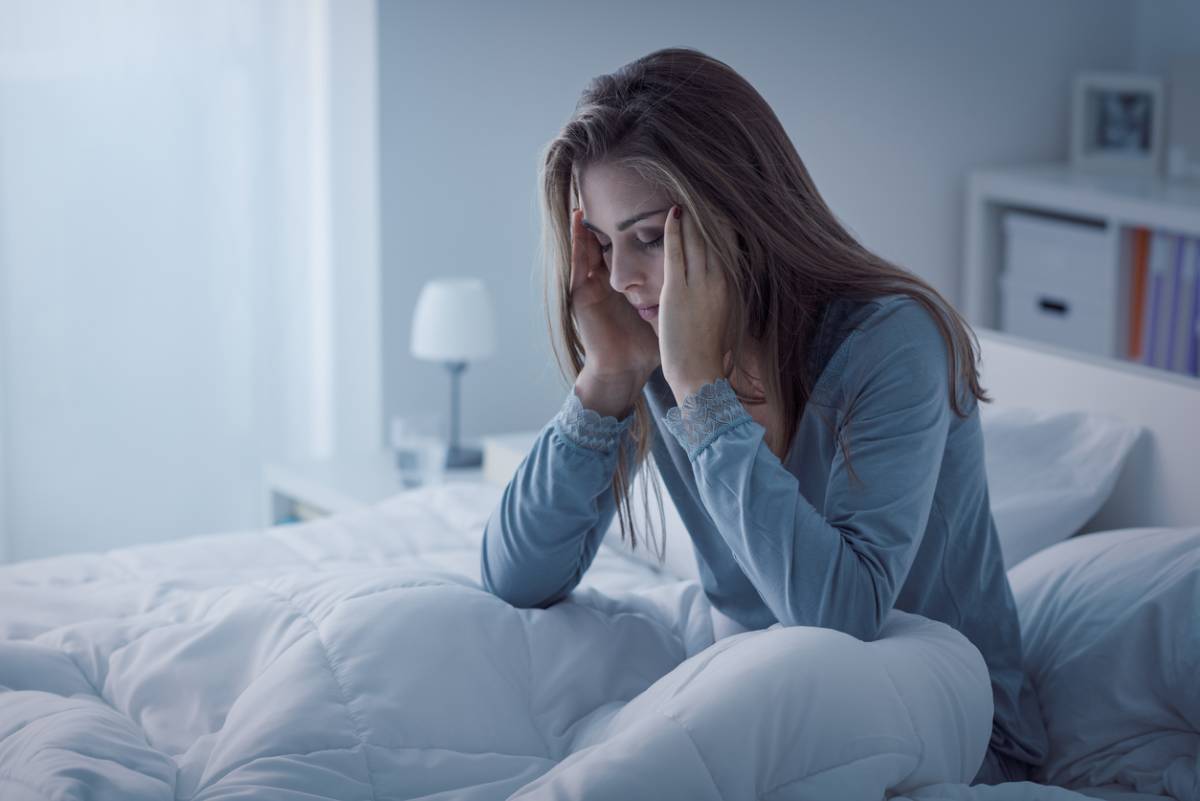 woman with stress finding it hard to sleep